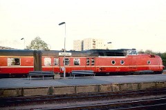 DSB MA trainset photographed at the railway station in Fredericia June 1976.  The MA was built by Machinenfabrik Augsburg-Nürnberg (MAN) in Germany. The coaches were built by Linke-Hoffmann-Busch, Germany - the restaurant coaches by Wegmann & Co. Germany. Totally the trainsets were delivered in a number of 11 - the first ones put in service in 1963. The trainsets were based on the German type 11.5, but the Danish version had to be chanced a lot to fit the size of the ferries taking the trains across Storebælt. The MA class served the socalled "Lyntog". Diesel 12 cyl. 1.100 hp. Max speed 160 km/h - 100 mph. Weight 51 metric tonnes. The MA class was in 1983/1984 painted in a silver grey colour. The trainsets were withdrawn from service in 1990.